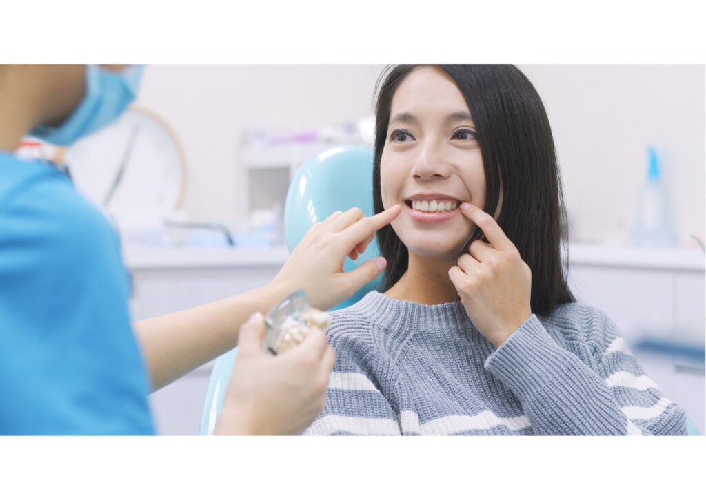 Patient discussing single tooth implant treatment options during a dental consultation