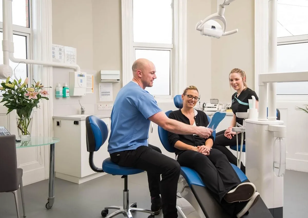 Dentist discussing dental bonding treatment with a patient.